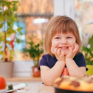 a girl smiling at the camera