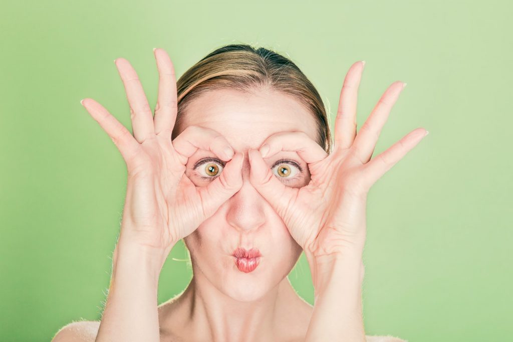 a woman with her hands up