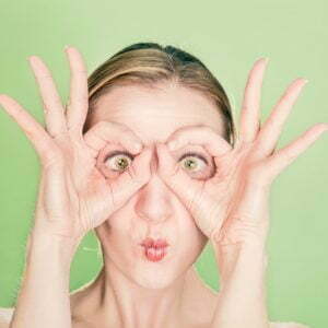 a woman with her hands up