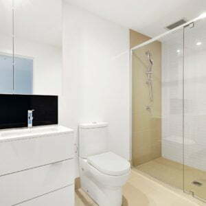 a bathroom with a shower and toilet