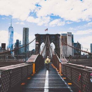 a bridge with a bridge and a city in the background