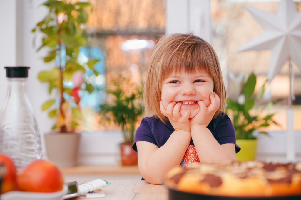 a girl smiling at the camera