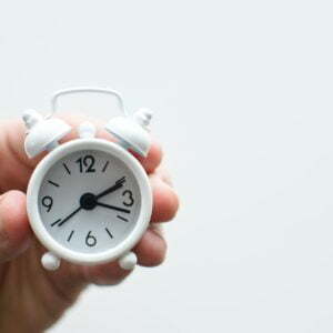 a hand holding a stopwatch