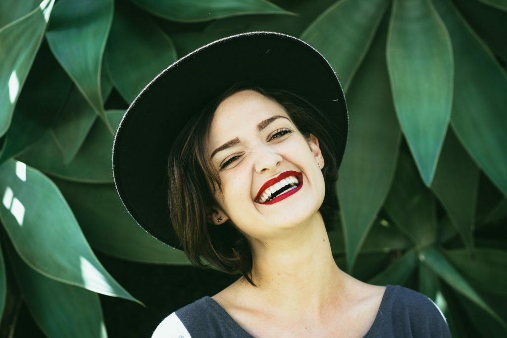 a woman smiling with her mouth open