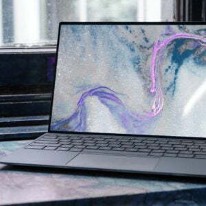 a laptop with a colorful design on the screen