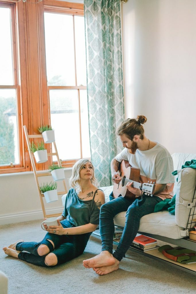 a man and a woman playing a video game