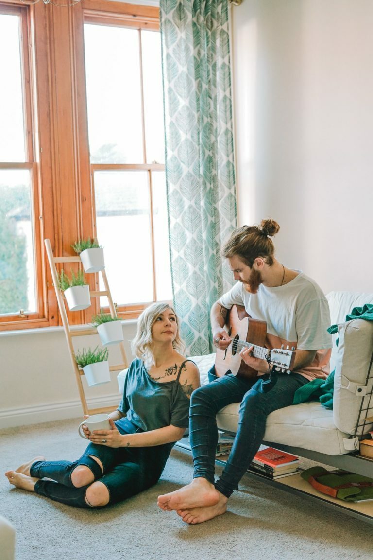 a man and a woman playing a video game