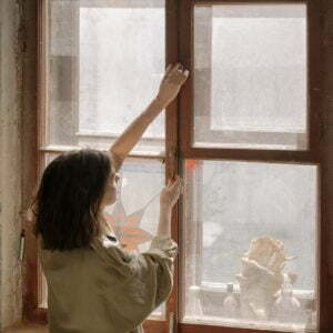 a person looking out a window