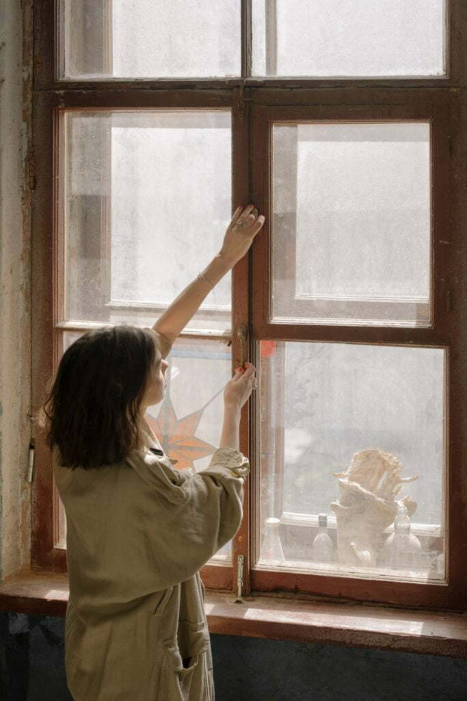 a person looking out a window