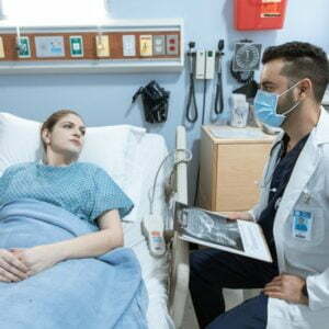 a doctor checking a patient's blood pressure