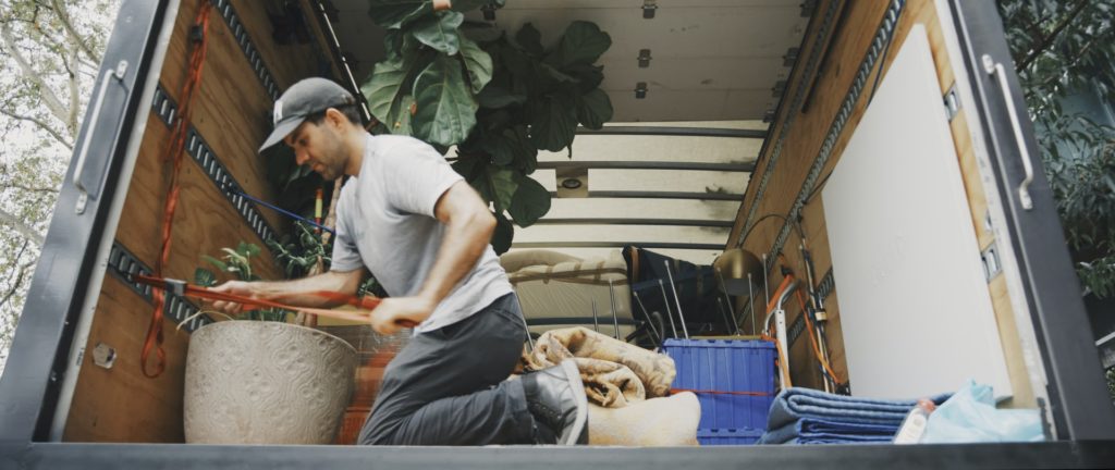 a man sitting on a bed