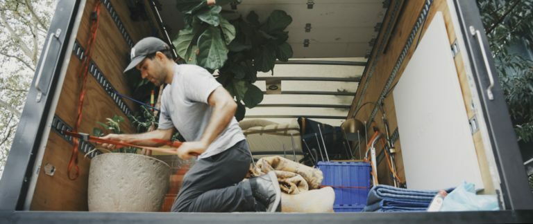 a man sitting on a bed