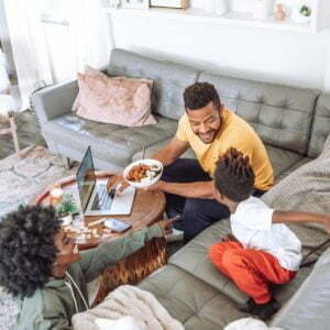 a family eating in the living room