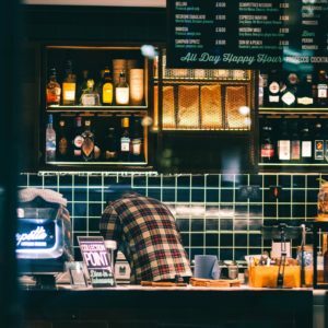 a person standing behind a counter