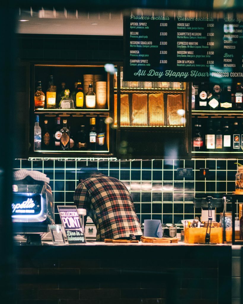 a person standing behind a counter