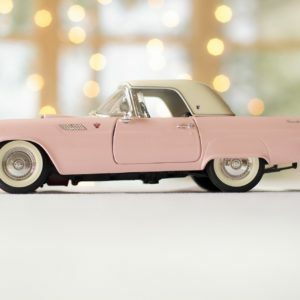 a pink car with a black rim