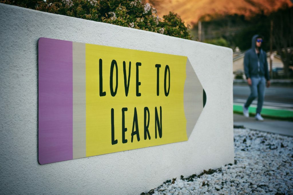 a yellow and white sign