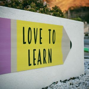 a yellow and white sign